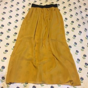 Cute sheer mustard colored skirt.